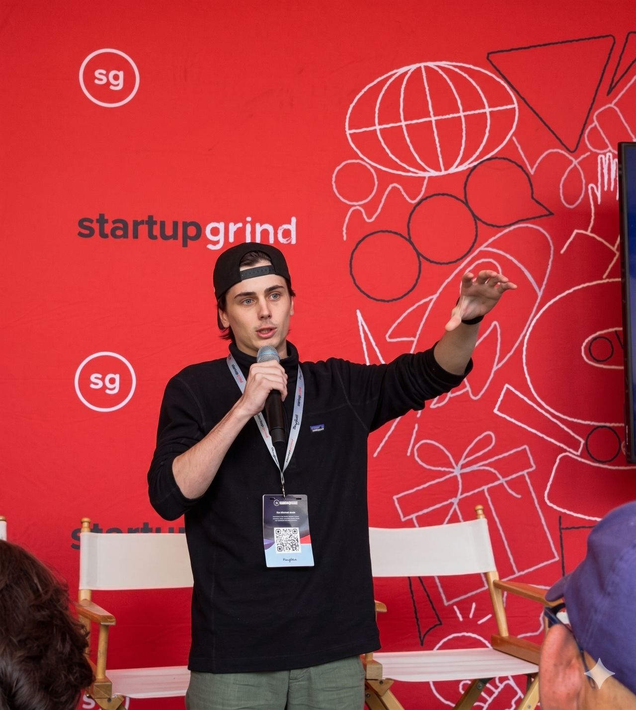 BAI Analytics presenting on stage at Startup Grind in the Bay Area